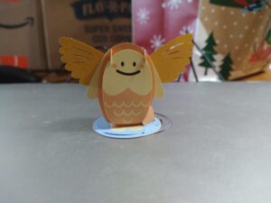 Papercraft fish with golden wings