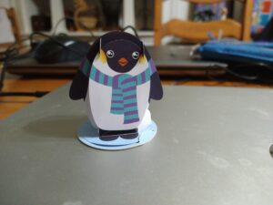 A penguin wearing a scarf.